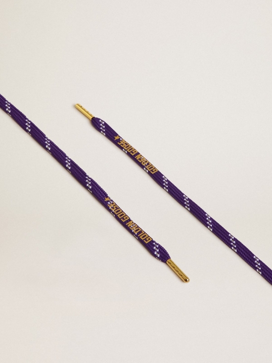 Purple laces with decorations and contrasting gold-colored logo